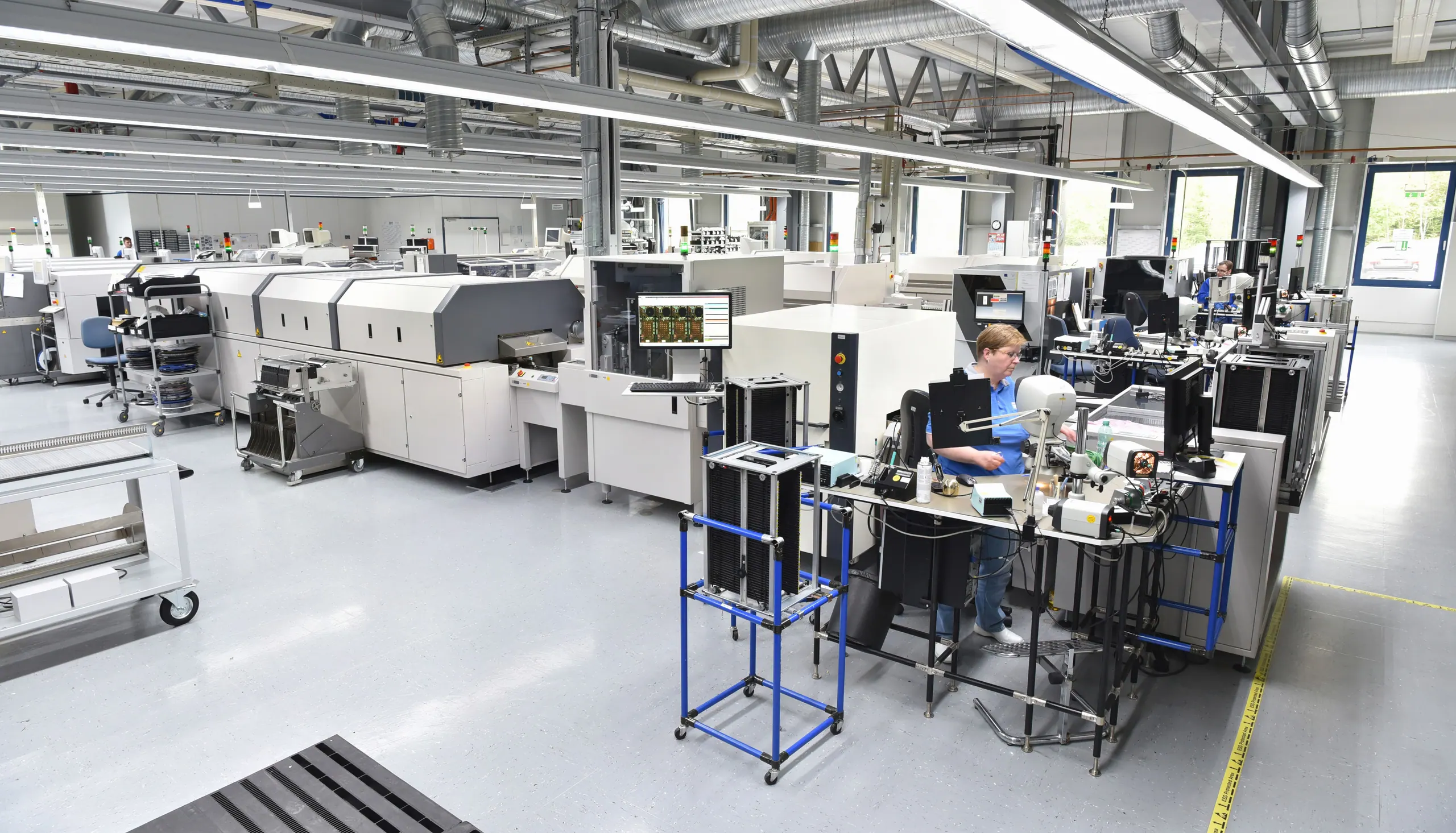 Electronics manufacturing equipment on a production line.