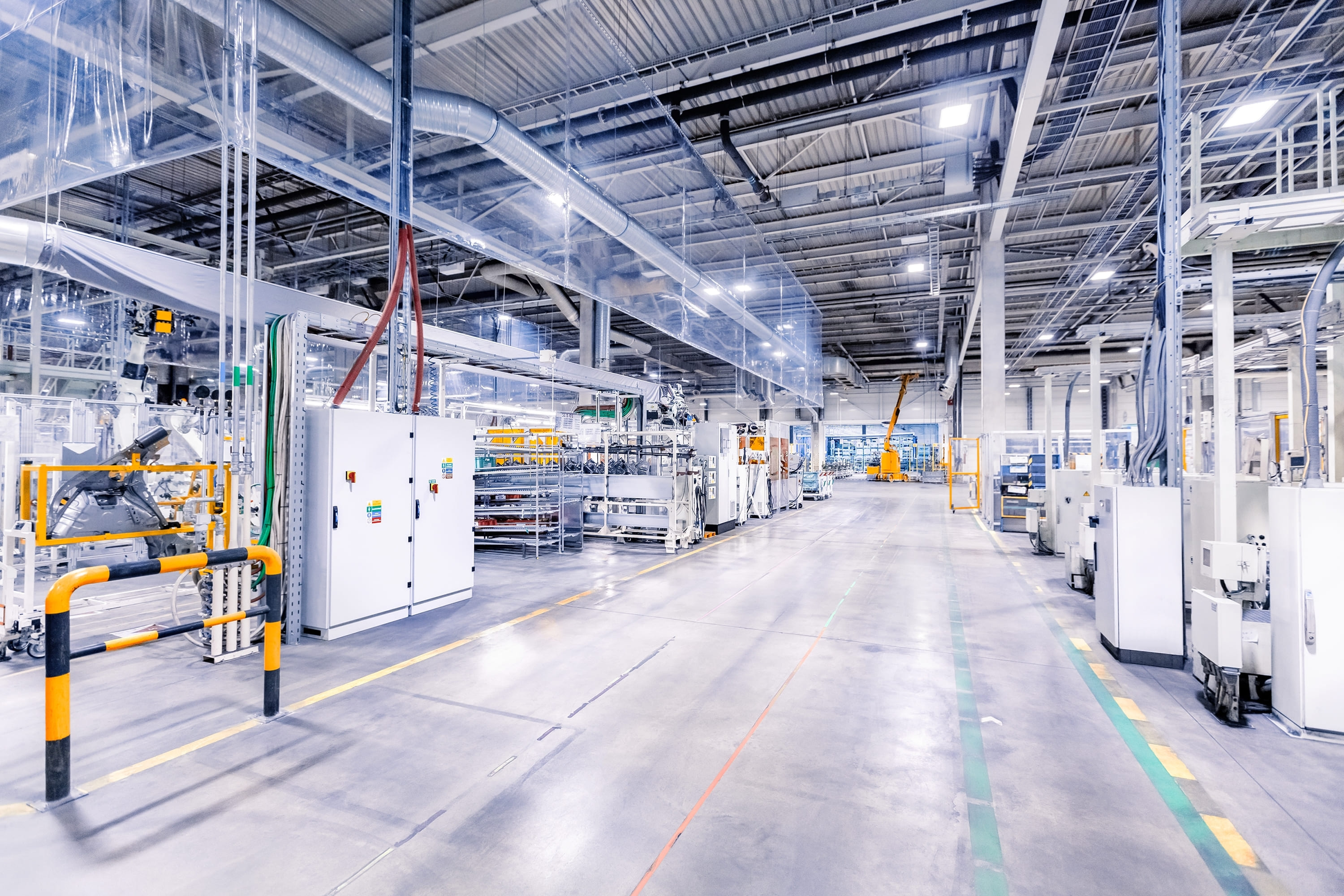 A modern factory floor with industrial machines ready for integration.