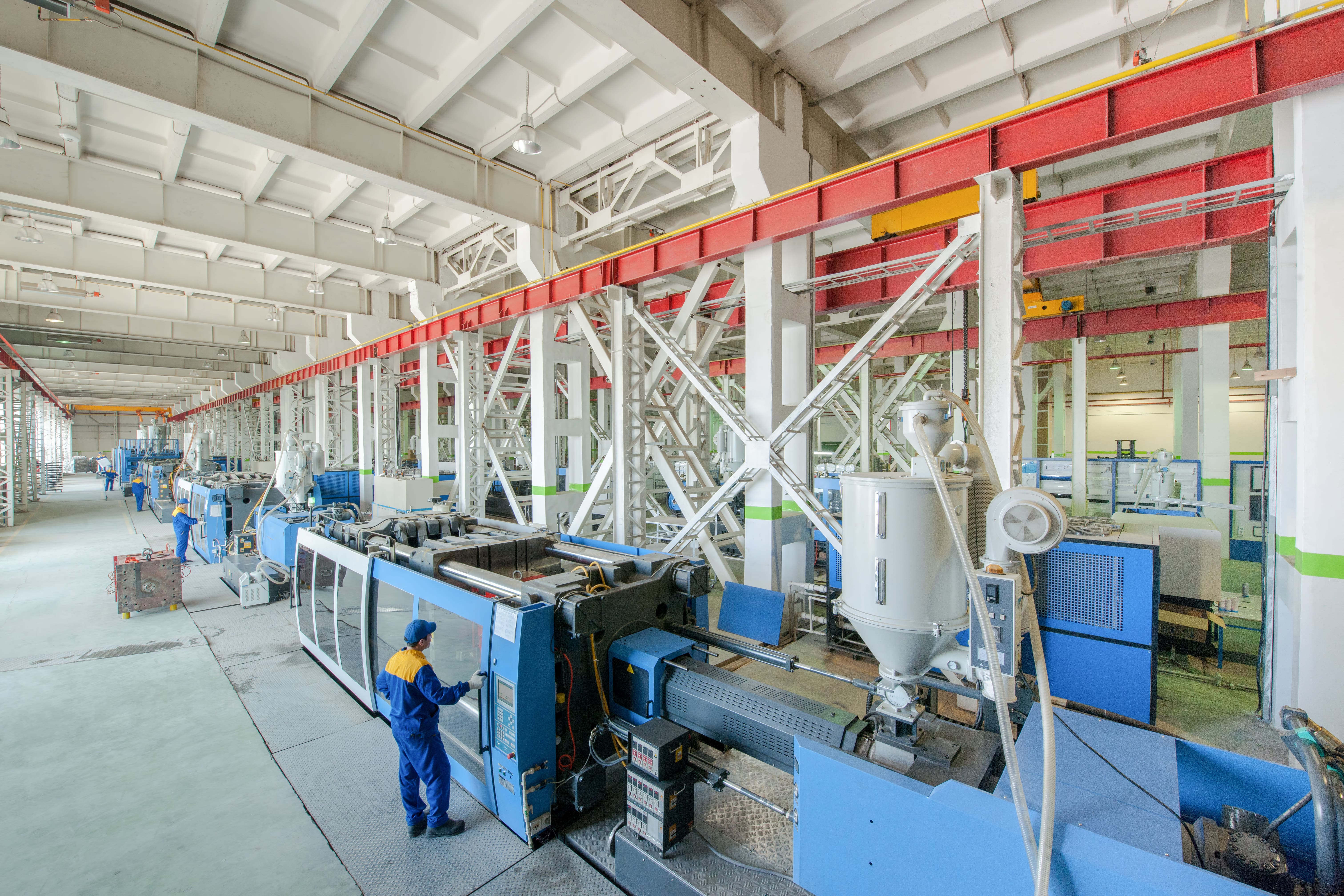 Plastics production equipment inside a manufacturing facility.