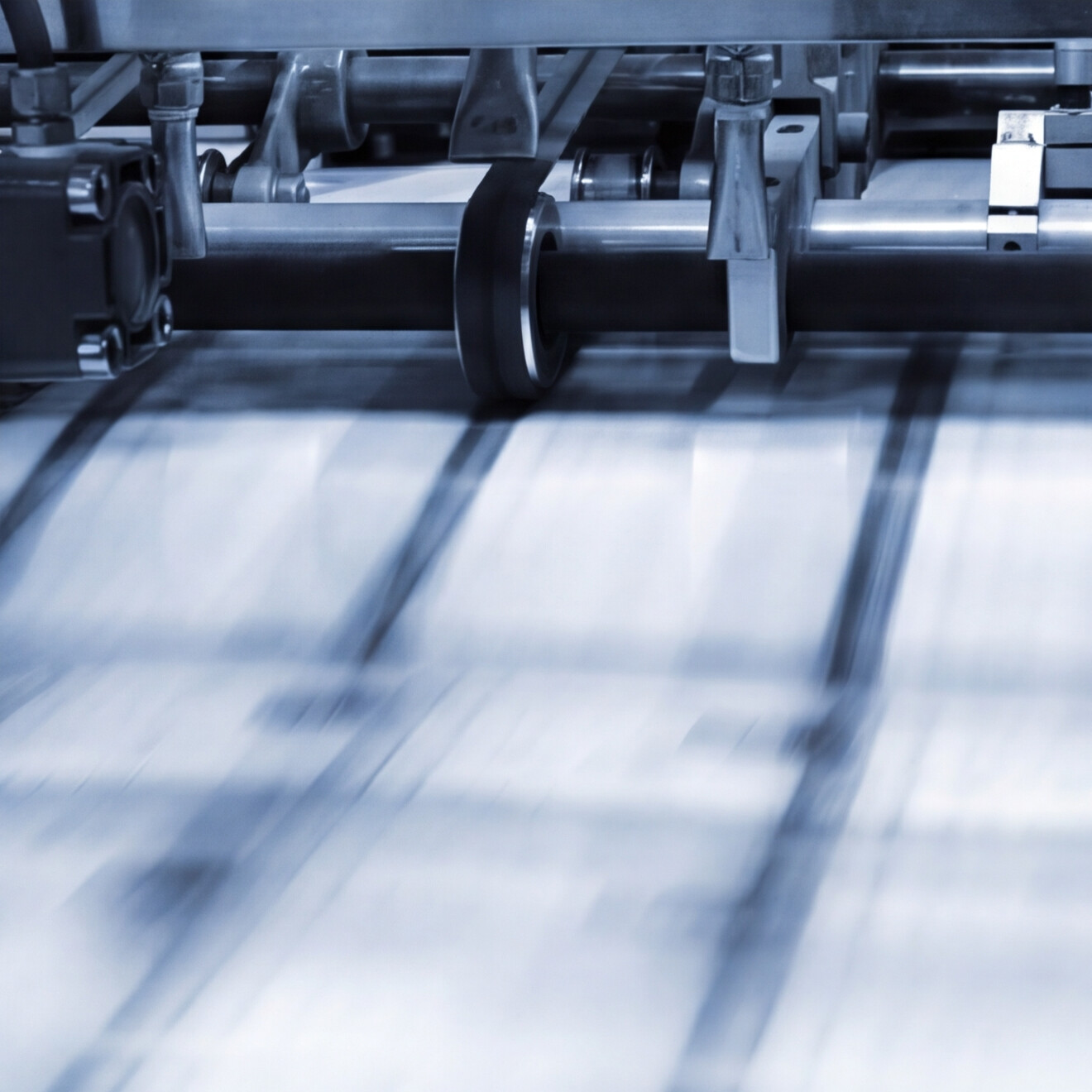 Secure materials moving through industrial printing equipment.