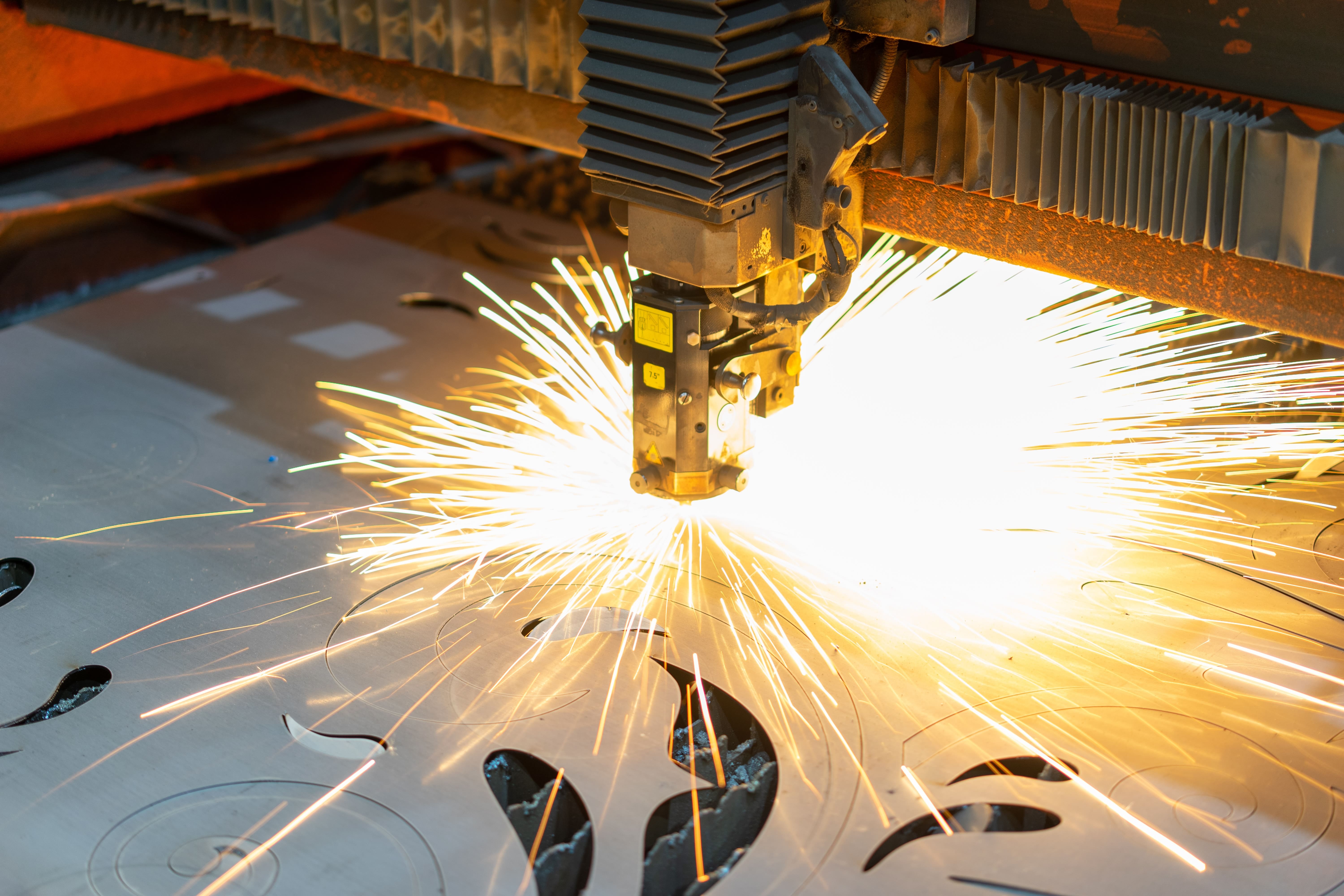Industrial laser cutting through metal