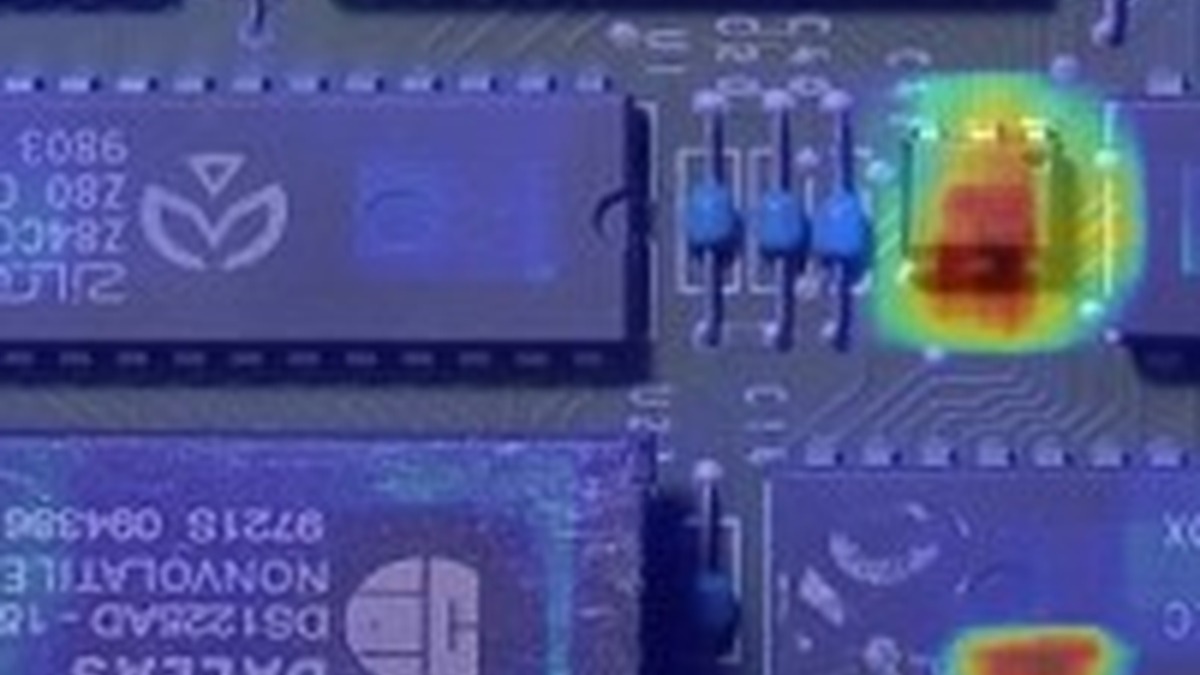 Anomaly heatmap highlighting an unusual area on an electronic circuit board.